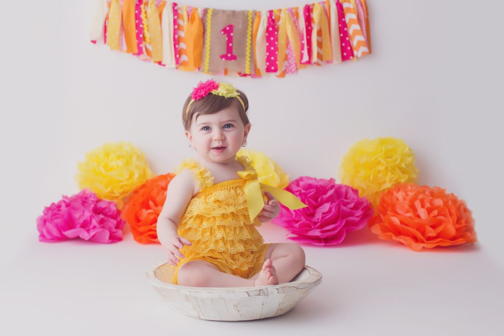 look who's one! pink orange and yellow one year old photo session Alyssa Joy Photography