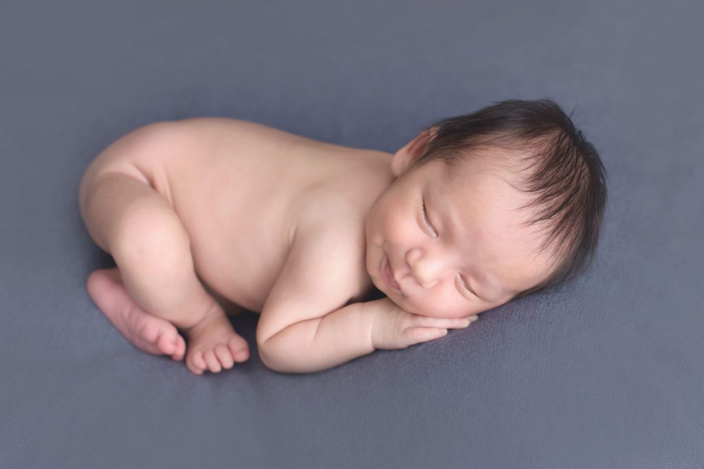 one month old newborn boy smiling in newborn photo session Alyssa Joy Photography