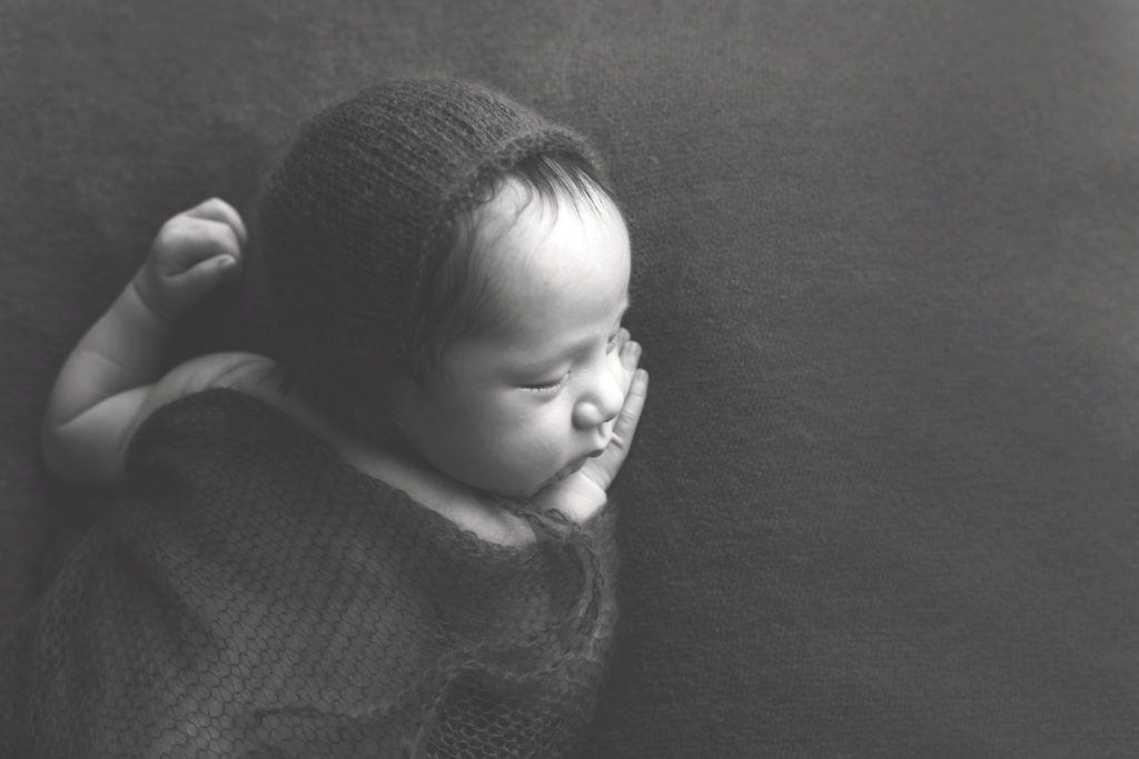 black and white image of 4 week old newborn baby boy side profile Alyssa Joy Photography