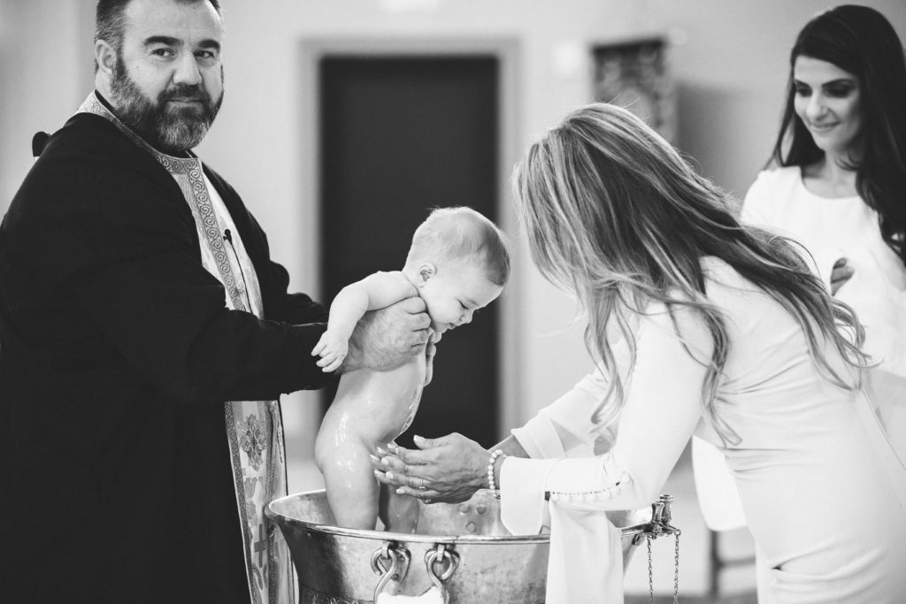 photograph of baptism of baby Emilia with Father and God Mother black and white