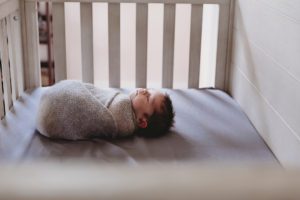 newborn baby boy in crib alyssa joy